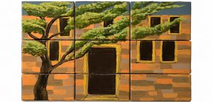 Dies ist eine der Kulissen des Musicals. Sie zeigt ein Haus aus Lehm mit einem Baum davor.